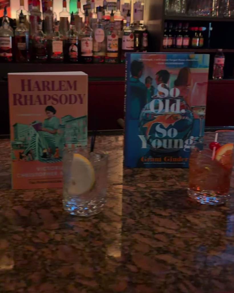 Books by visiting authors on the bar at Alchemy