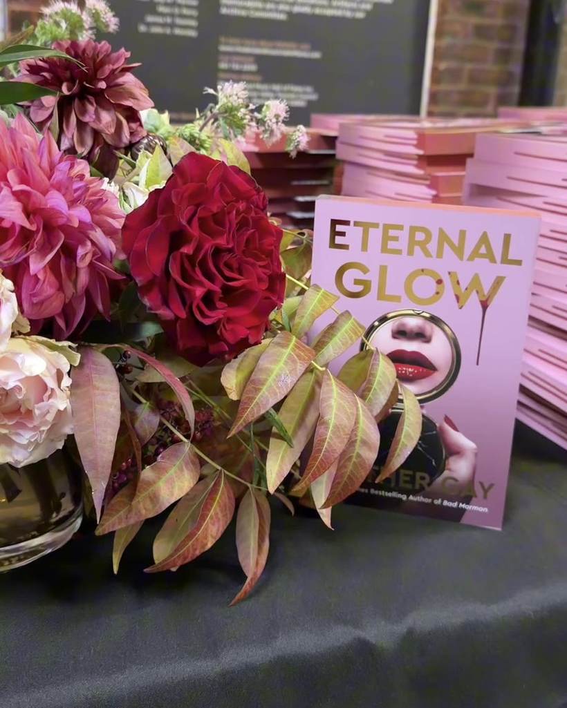 Copies of Eternal Glow and flowers at the Heather Gay book launch
