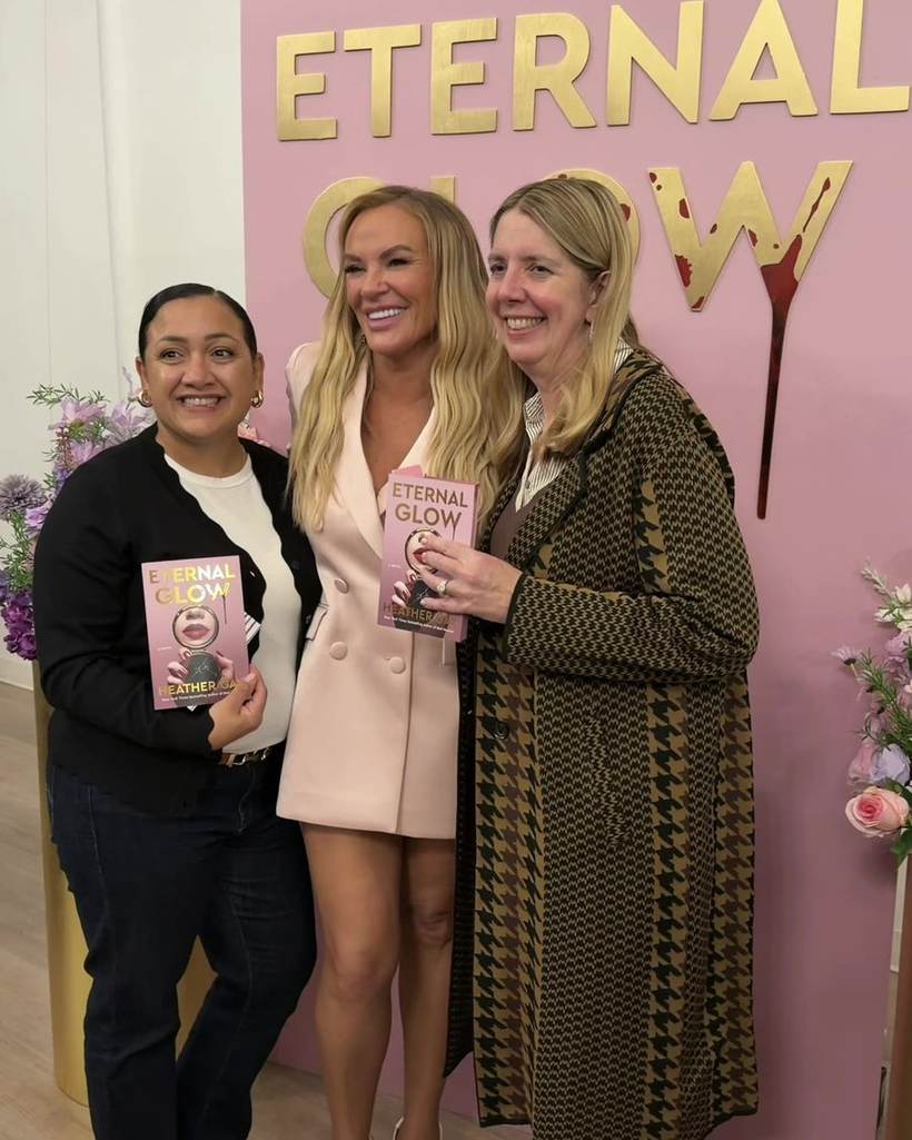 Heather Gay posing with readers at her Eternal Glow launch