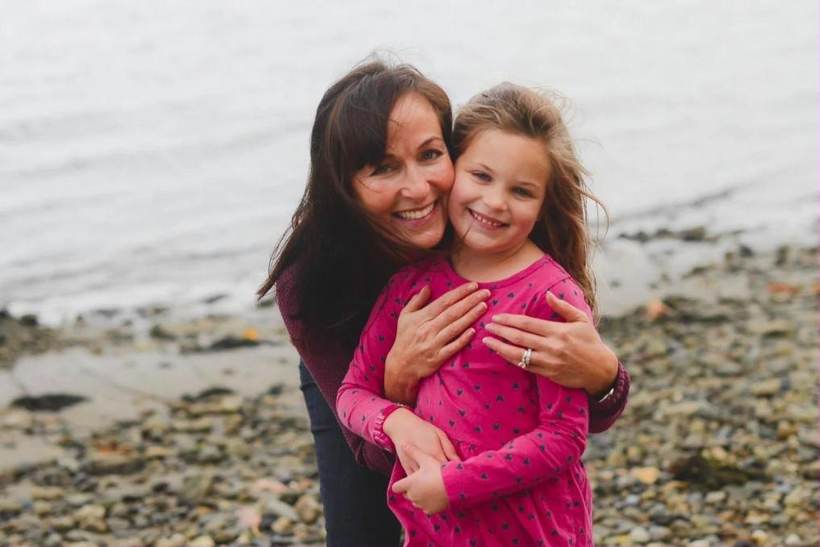 Family photography of a mom and daughter on a Rhode Island beach