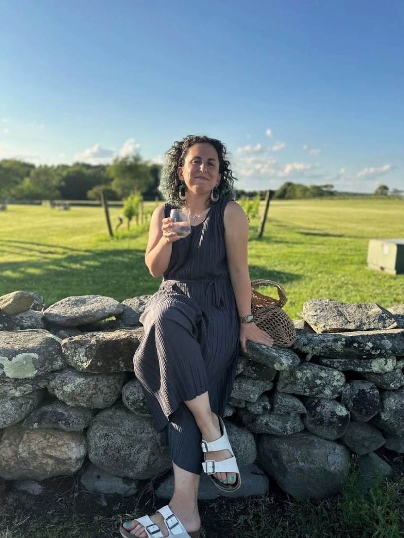Emily Homonoff smiling at a Rhode Island vineyard
